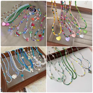 Variety of colorful beaded necklaces with pearl accents and heart charms