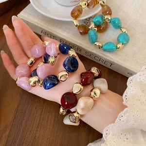 Vintage style irregular marbled beaded necklace with metallic gold accents for women