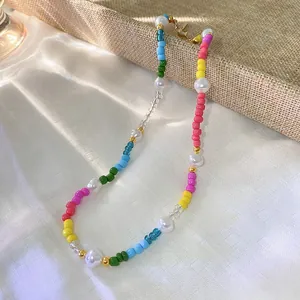 Detailed view of handmade colorful bead necklace with irregular freshwater pearls