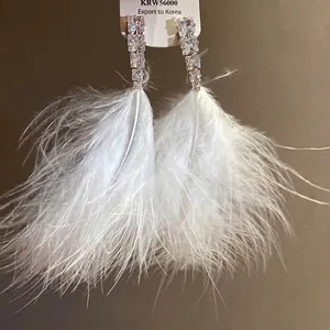 Silver needle cubic zirconia earrings with white feather tassels for elegant women