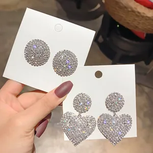 Glamorous sparkling rhinestone heart and round drop earrings on white display cards