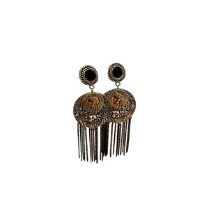 Vintage retro style coin tassel drop earrings with ornate filigree design on white back
