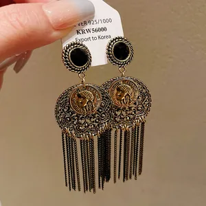 Vintage French portrait coin earrings with black stones and long gold-tone tassels