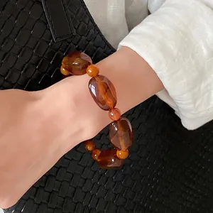 Vintage Maillard style amber acrylic irregular bead bracelet for women on wrist