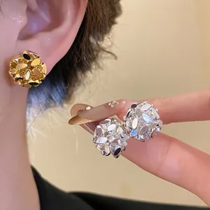 Detailed macro view of luxury 18k gold-plated floral cluster clip-on earrings for women