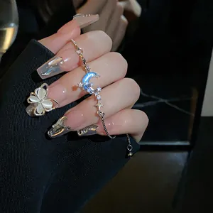 Macro view of an elegant zircon crescent moon and star pull-out bracelet for women