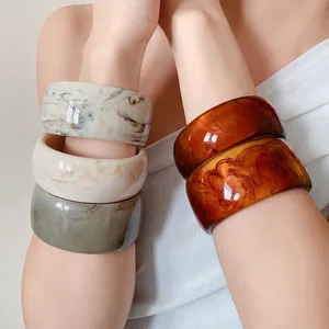 Stylish marbled acrylic bangles set for women featuring elegant resin finish and wide band design