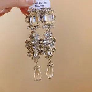 Luxury long drop earrings with square crystals and teardrop pendants in silver finish