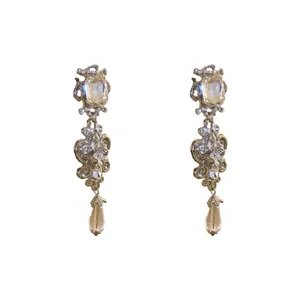 Elegant vintage floral teardrop dangling earrings with silver needles and clear rhinestones