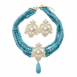 Vintage court style jewelry set with multi-layer blue beads and ornate gold pendants