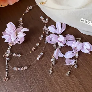 Elegant lavender fabric flower jewelry set with pearls and crystals, necklace and earrings