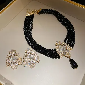 Elegant multi-layer black pearl necklace and crystal earring jewelry set in retro style