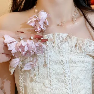Detailed view of sweet pink fabric flower jewelry set with pearls and crystal beads