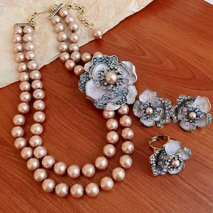 Vintage pearl flower necklace set with crystal earrings and matching ring detail