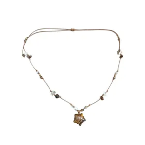 Collier pendentif étoile en oeil de tigre vintage avec cordon tressé et pierres