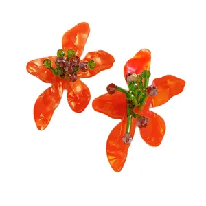 Vibrant orange floral acetate earrings with handcrafted green crystal bead stamens