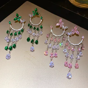 Detailed view of elegant zircon butterfly earrings with cascading water drop tassels.