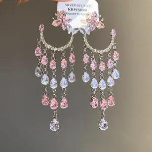 Macro view of pink zircon butterfly water drop tassel earrings showing fine details
