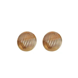 Elegant gold metallic striped round ball stud earrings with a chic minimalist design