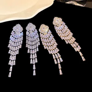 Close-up detail of luxurious long zircon tassel earrings featuring brilliant sparkle and shine