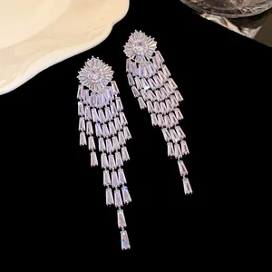 Close-up of sparkling zirconia tassel earrings with multi-layered crystal drops.