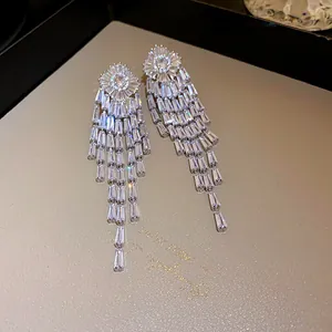 Detailed close-up of premium zircon tassel earrings with luxury gold-plated silver needles