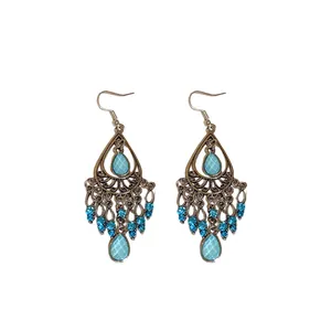 Orecchini pendenti in stile etnico vintage bohémien con strass blu e nappine eleganti
