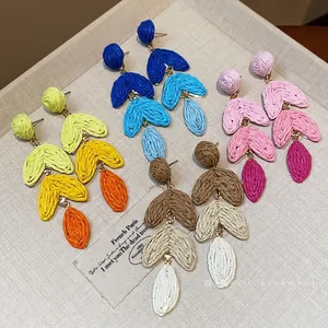 Handmade raffia heart drop earrings with silver needles in vibrant dopamine colors