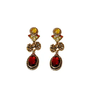 Vintage style bow and oval crystal drop earrings with ruby and topaz colors.