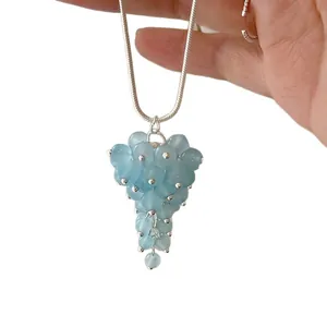 Elegant light blue glass bead grape pendant necklace with a minimalist silver snake chain