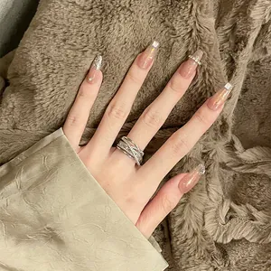 Detailed close-up showing the sparkling zircon multi-layer cross open ring on a hand.