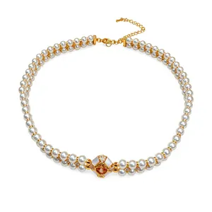 Elegant double-strand pearl necklace featuring an 18k gold plated zircon centerpiece