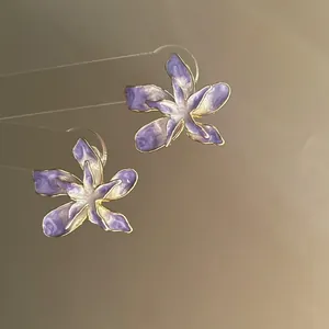 Elegant purple and white drip oil flower stud earrings with a gold-plated finish