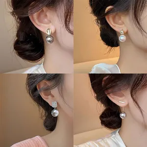 Close-up collage of four French vintage pearl earring styles on a model's ear