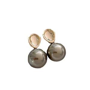 French vintage pearl drop earrings with gold hammered metal, elegant minimalist jewelry.