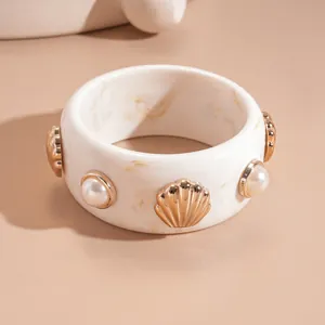 Irregular marbled resin bangle with gold shell and pearl accents