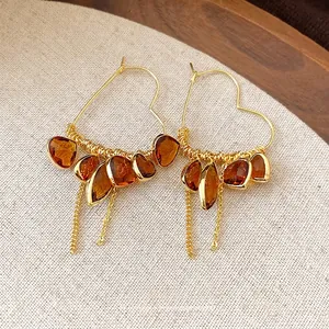 18K gold plated heart-shaped hoop earrings with amber teardrop stones and tassels