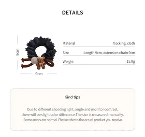Detailed view of navy lace hair tie with flocking bear charm and 9cm dimensions.