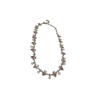 Elegant silver choker necklace with pink heart-shaped crystals and lustrous white pearls.