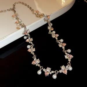Detailed view of elegant irregular heart crystals and pearl clavicle choker necklace