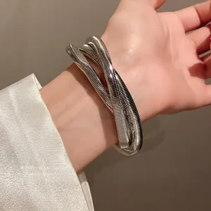 Edgy punk style silver-toned metal wrap spiral bracelet for a minimalist fashion look