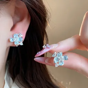 Elegant light blue flower pearl ear clips with 18k gold plating for non-pierced ears