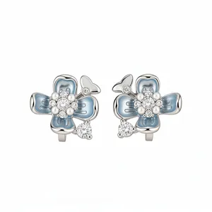 Elegant light blue enamel flower clip-on earrings with white pearls and crystals