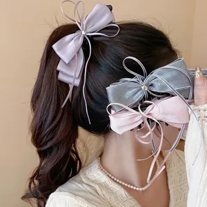 Elegant satin ribbon bow hair clips set with sophisticated chiffon textures for women