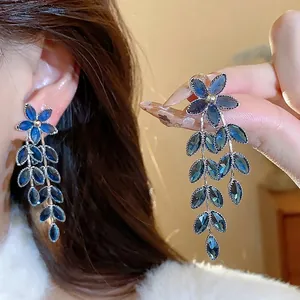 Elegant blue glass flower and wheat leaf tassel earrings with silver needles for women