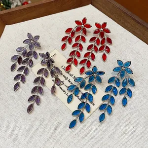 Elegant flower and leaf fringe drop earrings in red, purple, and blue glass crystal