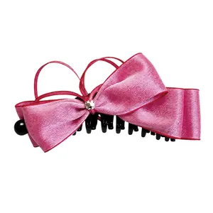 Elegant pink silk ribbon bow banana hair clip in stylish Korean fashion design