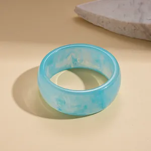 Elegant sky blue marbled resin bangle bracelet with a unique niche retro design for women