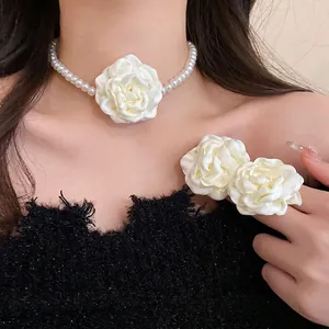 Elegant white fabric rose pearl necklace set with matching floral accessories
