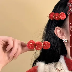 Elegant red flocked hair clip set with lion dance earrings for festive Lunar New Year